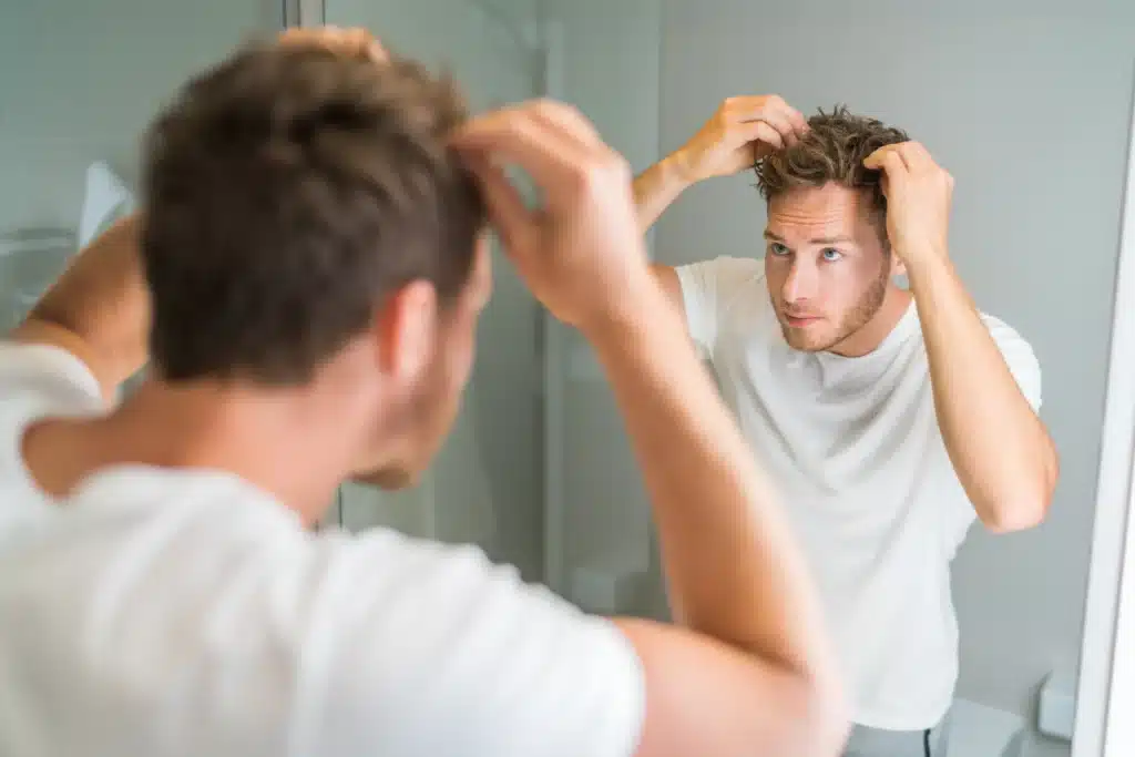 man using hair styling products